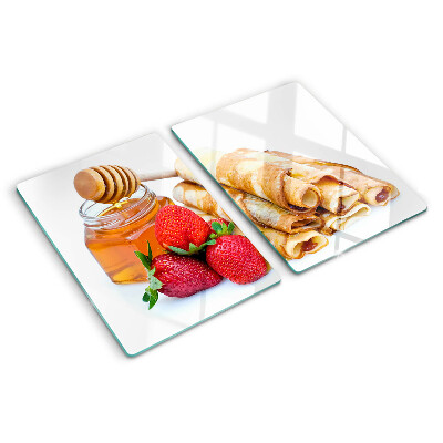 Glass cutting board Pancakes with honey and strawberries