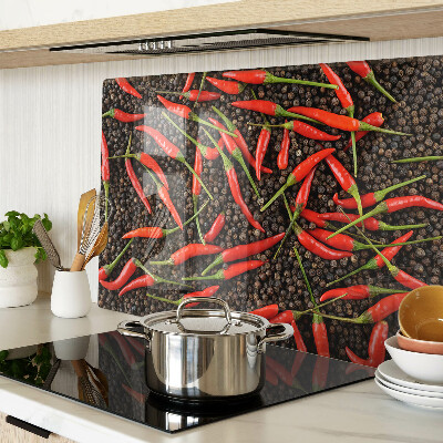 Cutting board Chili peppers on black pepper
