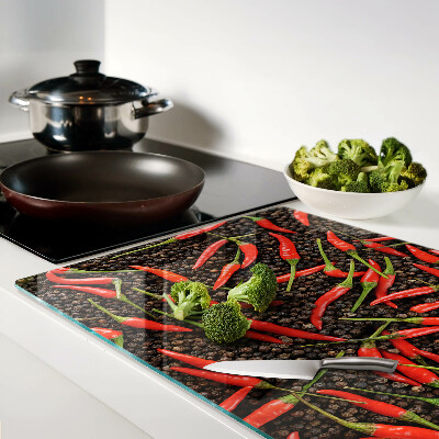 Cutting board Chili peppers on black pepper