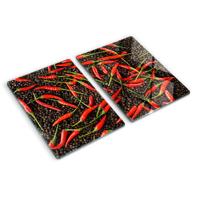 Cutting board Chili peppers on black pepper