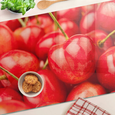 Glass kitchen board Cherries on a red background