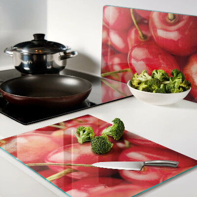 Glass kitchen board Cherries on a red background