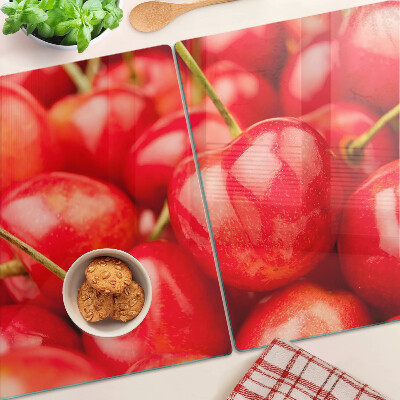 Glass kitchen board Cherries on a red background