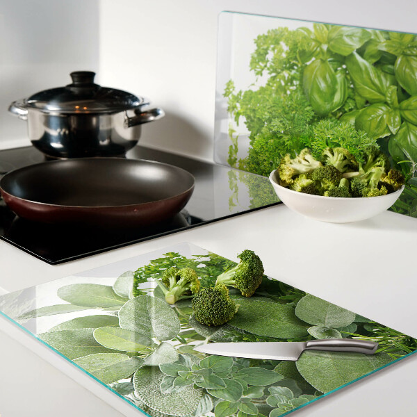 Chopping board glass Green herbs and leaves