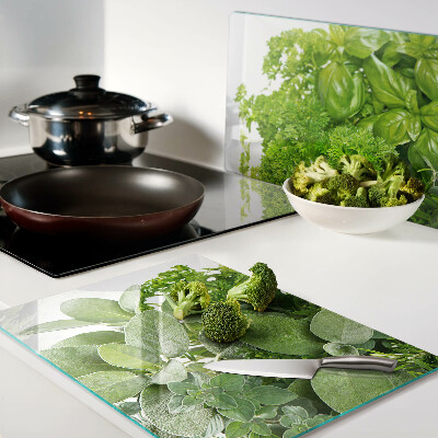 Chopping board glass Green herbs and leaves
