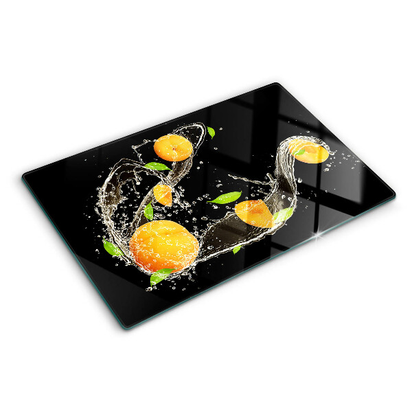 Glass cutting board Citrus fruits in water