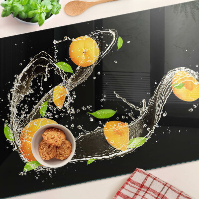 Glass cutting board Citrus fruits in water