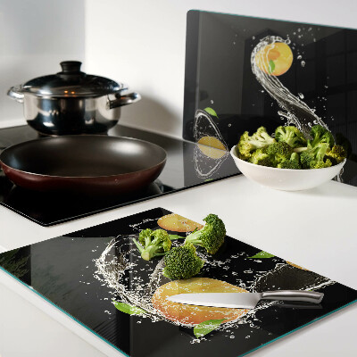 Glass cutting board Citrus fruits in water