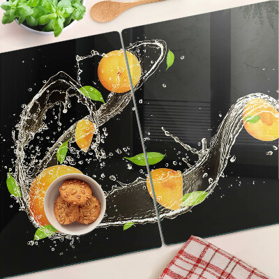 Glass cutting board Citrus fruits in water