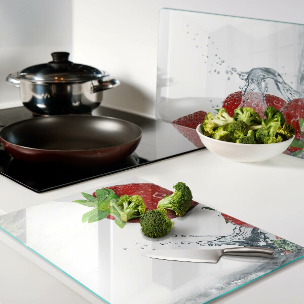 Chopping board glass Strawberries in water