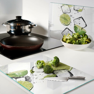 Glass chopping board Lemons with ice in water