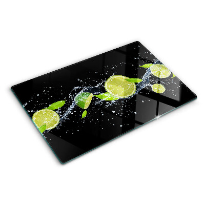 Chopping board glass Lemons in water with mint leaves