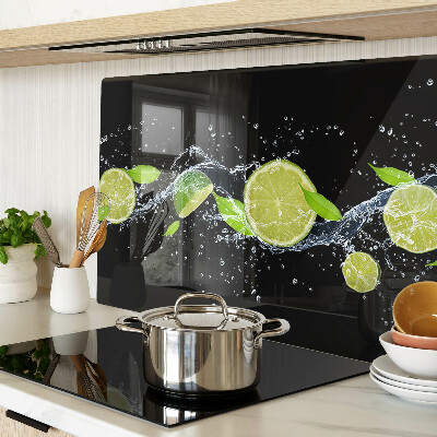 Chopping board glass Lemons in water with mint leaves