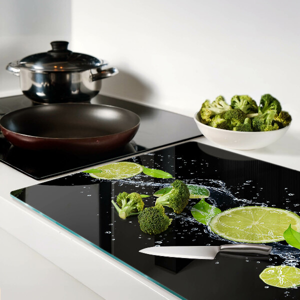 Chopping board glass Lemons in water with mint leaves