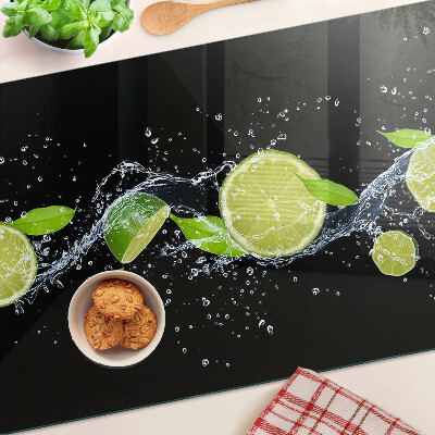 Chopping board glass Lemons in water with mint leaves
