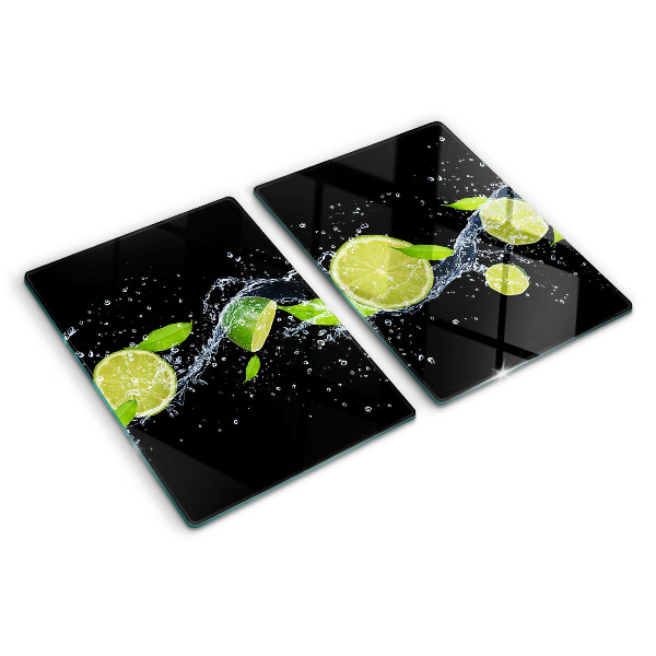 Chopping board glass Lemons in water with mint leaves