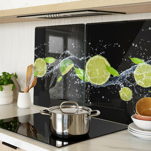 Chopping board glass Lemons in water with mint leaves