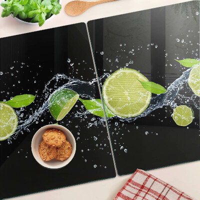Chopping board glass Lemons in water with mint leaves