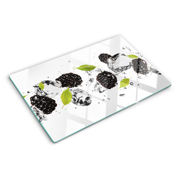 Glass cutting board Raspberries with leaves and drops of water