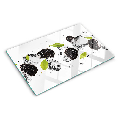 Glass cutting board Raspberries with leaves and drops of water