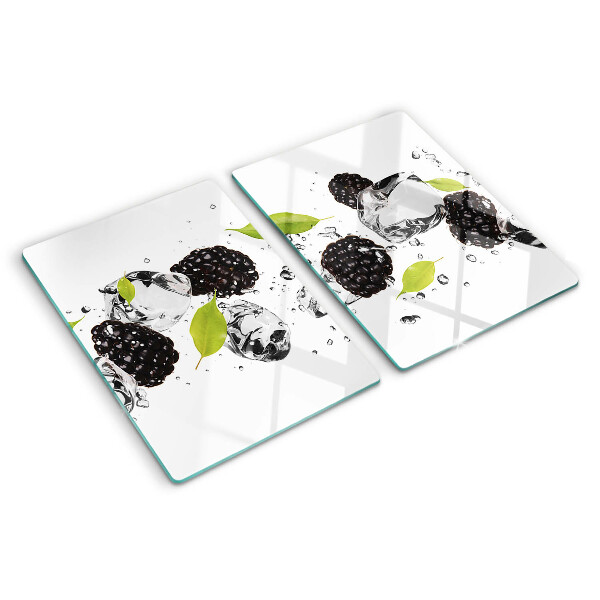 Glass cutting board Raspberries with leaves and drops of water