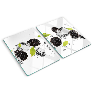 Glass cutting board Raspberries with leaves and drops of water