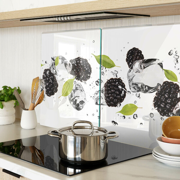 Glass cutting board Raspberries with leaves and drops of water
