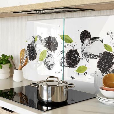 Glass cutting board Raspberries with leaves and drops of water