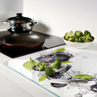 Glass kitchen board Plums in water with leaves