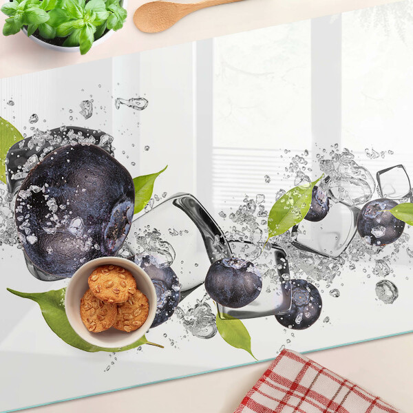 Glass kitchen board Plums in water with leaves