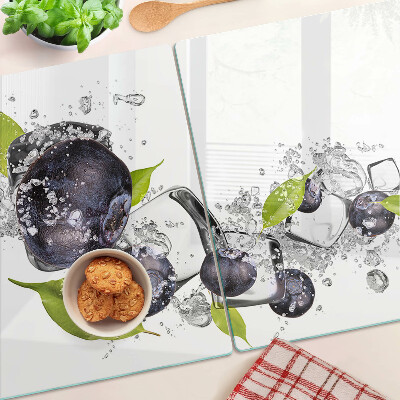 Glass kitchen board Plums in water with leaves