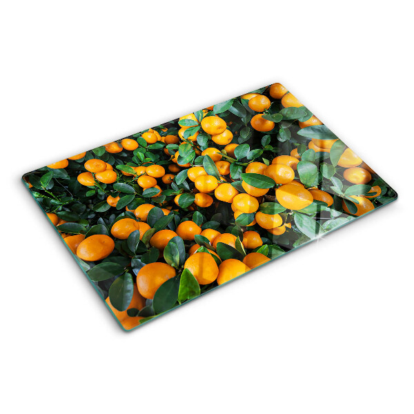Glass cutting board Mandarins on the branches