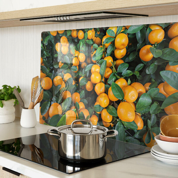 Glass cutting board Mandarins on the branches