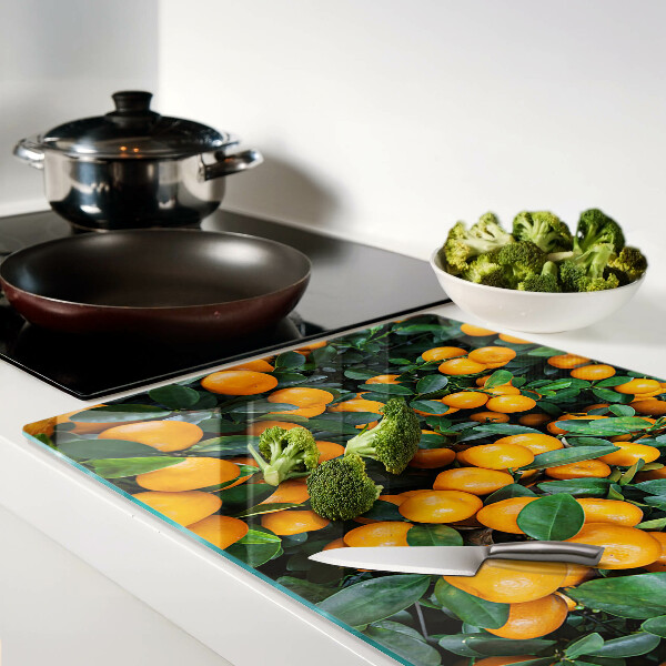 Glass cutting board Mandarins on the branches