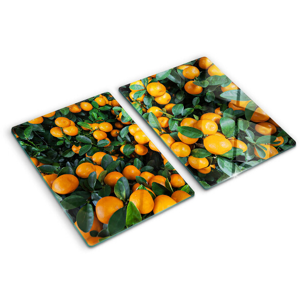 Glass cutting board Mandarins on the branches