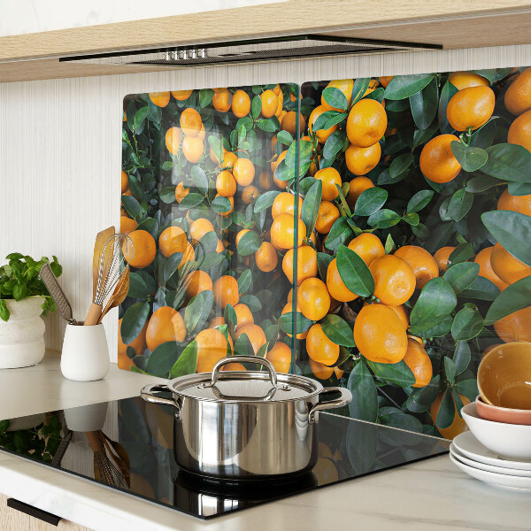 Glass cutting board Mandarins on the branches