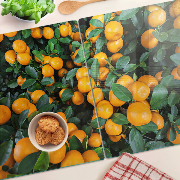 Glass cutting board Mandarins on the branches