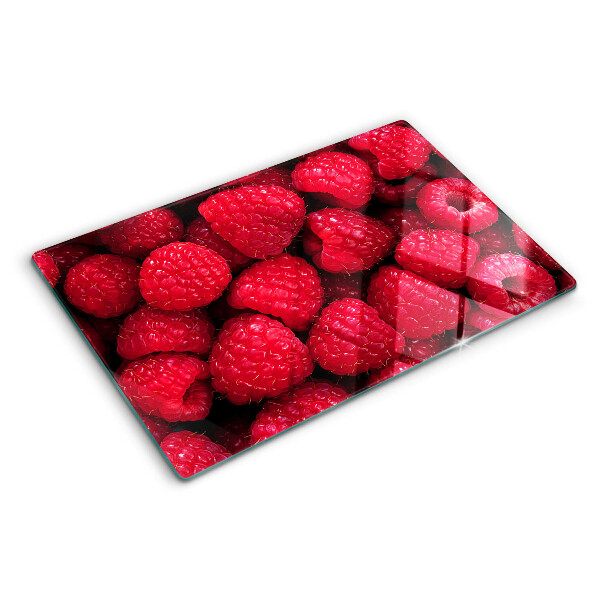 Chopping board Raspberries on the background