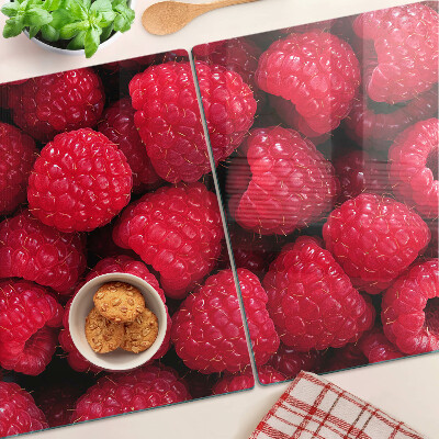 Chopping board Raspberries on the background