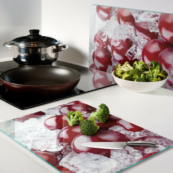 Chopping board glass Red grapes on ice