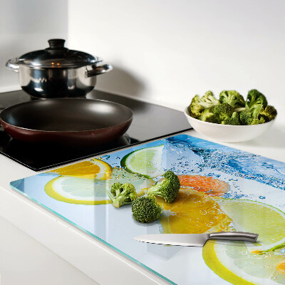 Chopping board glass Citrus fruits in water