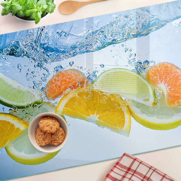 Chopping board glass Citrus fruits in water