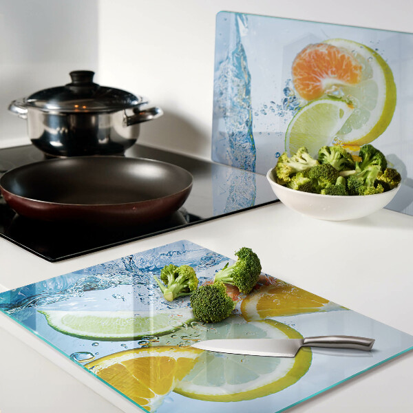 Chopping board glass Citrus fruits in water