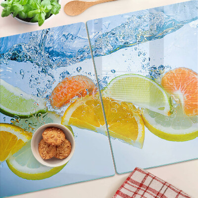 Chopping board glass Citrus fruits in water