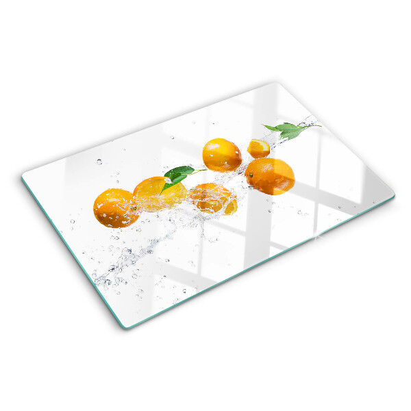 Chopping board glass Citrus fruits with water