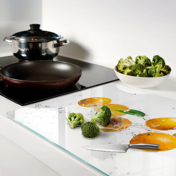 Chopping board glass Citrus fruits with water