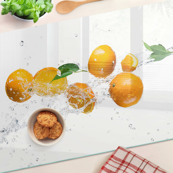 Chopping board glass Citrus fruits with water