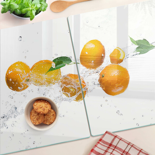 Chopping board glass Citrus fruits with water