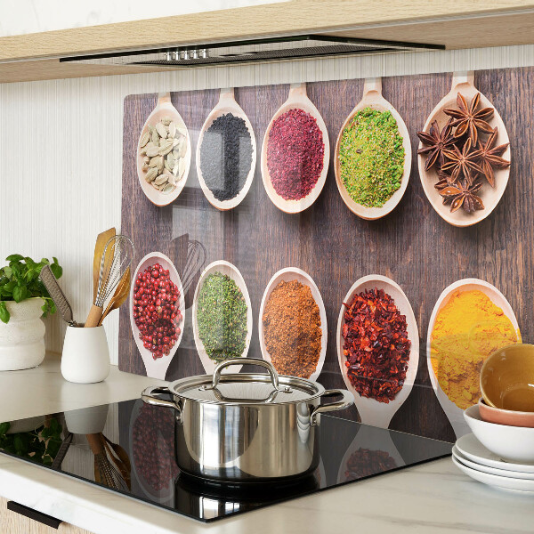 Glass chopping board Spices in spoons