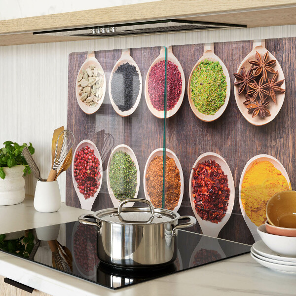 Glass chopping board Spices in spoons
